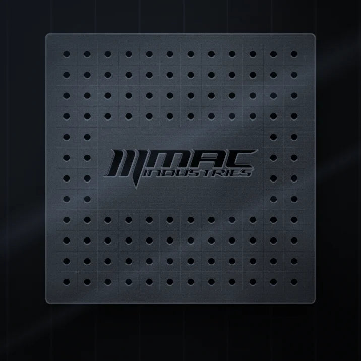 A finished 16D welding table top with the MAC Industries logo cut into it: 16 mm holes on a 50 mm grid, laser cut in Shobdon